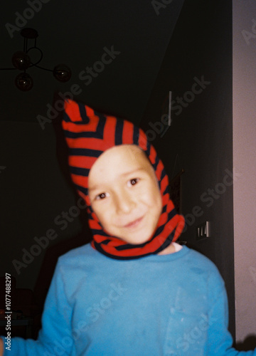 Smiling Child in Striped Hat