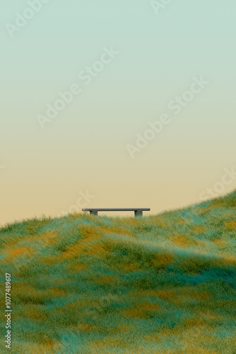 Lonely bench on a hill with green grass photo