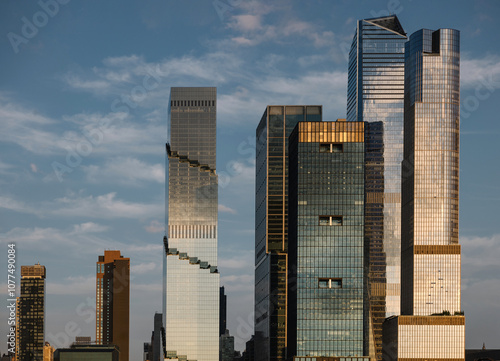 New York City modern skyscrapers under a cloudy sky at sunset photo