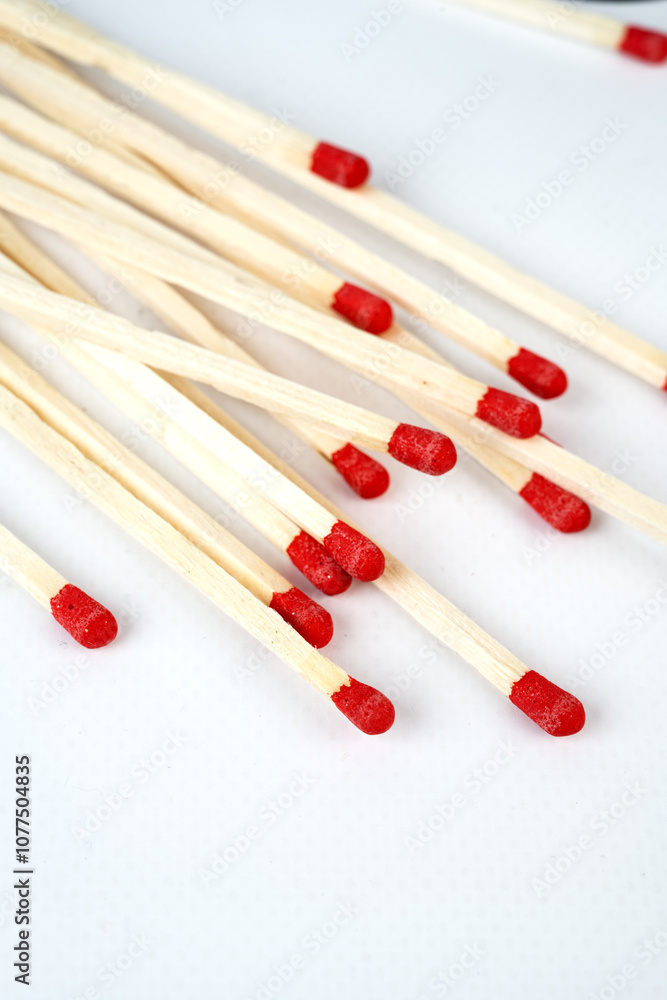 Matches on a pale background. Light it with matches. Matches on a pale background. Light it with matches.