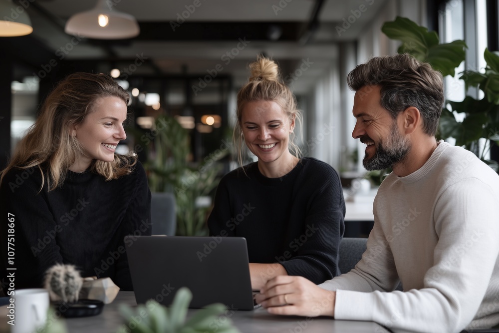 Friends Collaborate and Share Ideas in a Modern Workspace Friends Collaborate and Share Ideas in a Modern Workspace