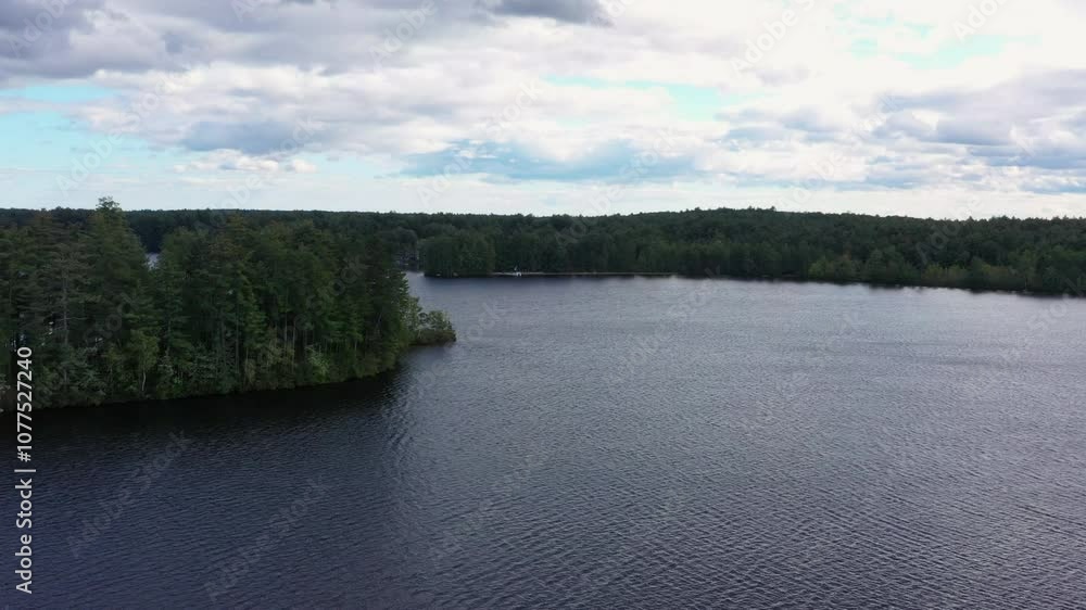 Establishing aerial view of lake water tilt from clouds 4k Establishing aerial view of lake water tilt from clouds 4k