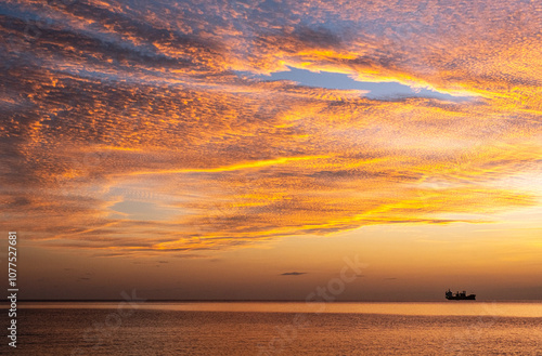 Cargo ship at sunset photo