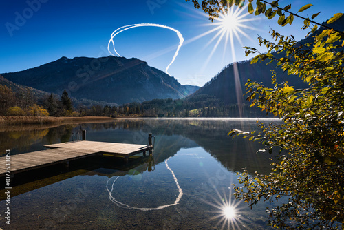 Kondensstreifen über dem Lunzer See in Niederösterreich photo