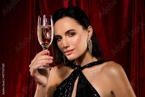 Photo of sensual classy girl wear glamour dress drinking sparkling champagne isolated red velvet background photo