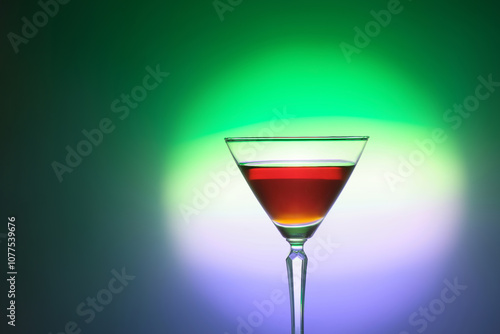 Elegant empty martini glass on a colored gradient  photo