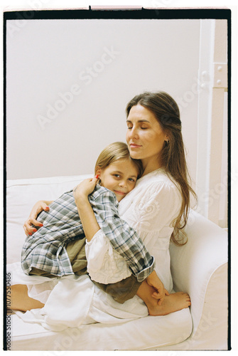 Tender Embrace Between Mother and Daughter at Home