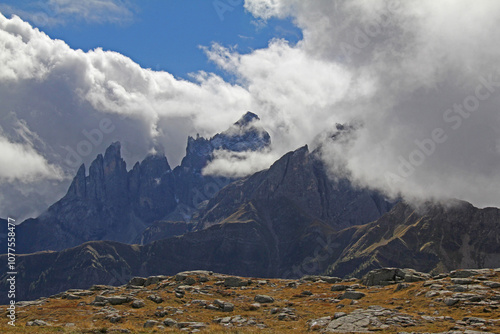 le creste frastagliate del Focobon si liberano delle nuvole; gruppo delle Pale di San Martino, Trentino photo