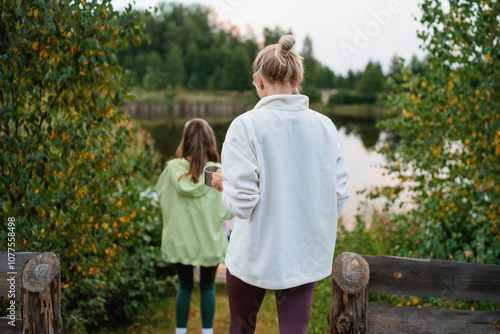 Women go to the lake shore photo