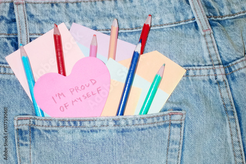 Jeans & heart post-it note saying 