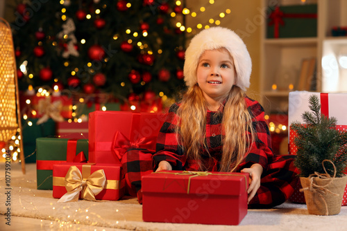 Happy little girl in santa ...