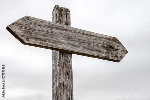 Rustic Wooden Arrow Signpost Against Cloudy Sky