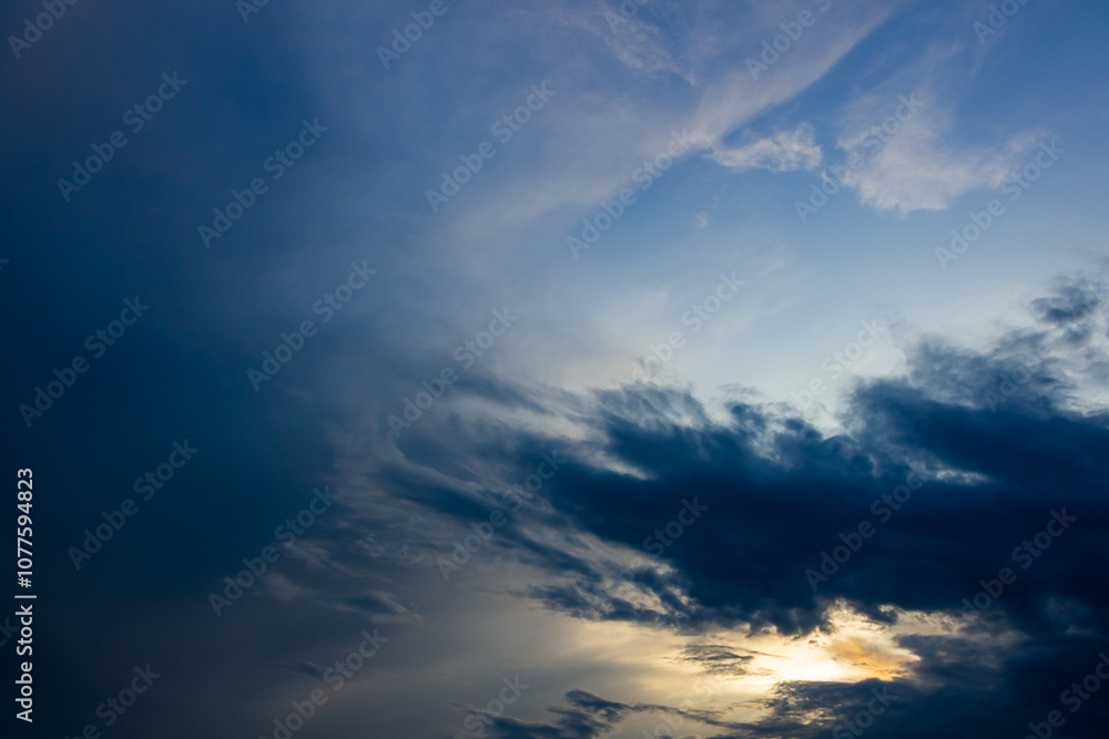 big clouds in the sky before the storm at sunset big clouds in the sky before the storm at sunset