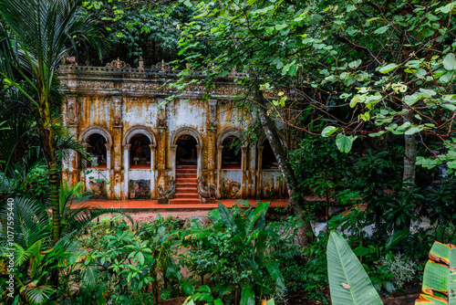 Natural background of ancient sculptures of religious tourist attractions, Naga statues, old churches by the natural waterfall from the high mountain, Wat Phalat, the way up to Doi Suthep, Chiang Mai photo