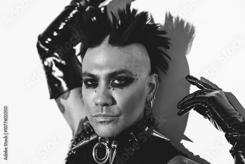 Edgy punk portrait featuring bold makeup and accessories