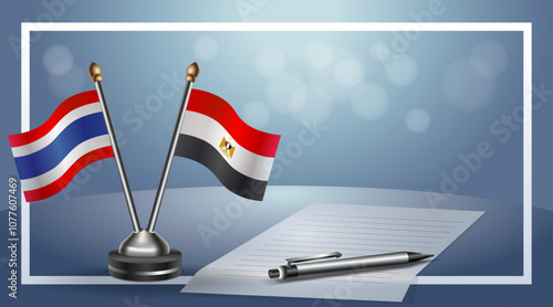 Thailand and EGYPT National flags on small table with bokeh background, cooperative relationship