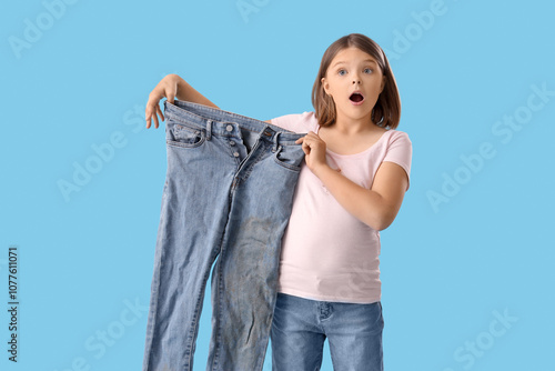 Shocked little girl with di...