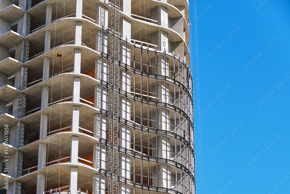 Installation of glass curtain wall. Structural glass wall installation. Residential building construction, metal frame installation for glass unit. Glazing facade.