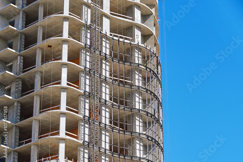 Obraz na płótnie Installation of glass curtain wall. Structural glass wall installation. Residential building construction, metal frame installation for glass unit. Glazing facade. w salonie