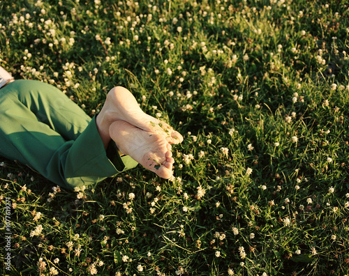 Relaxing Barefoot in a Lush Flower-Covered Meadow
