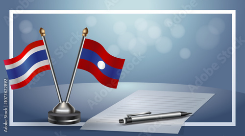 Thailand and Laos National flags on small table with bokeh background, cooperative relationship