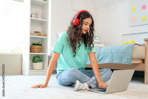 Teenage girl with headphone...