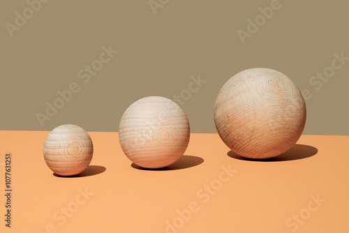 wooden balls of different sizes side by side photo