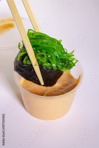 Sushi Japanese food with rice fish and nori with souse