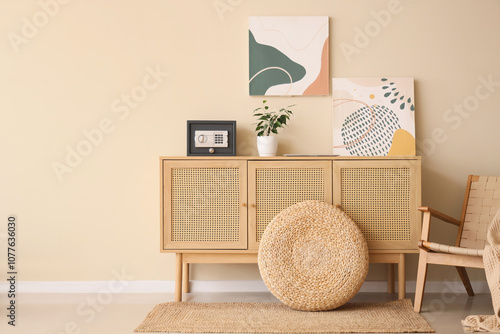 Modern safe, houseplant and...