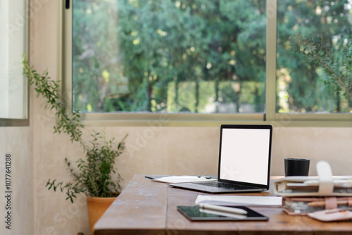  Laptop with blank screen on desk