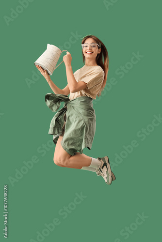 Female gardener with wateri...