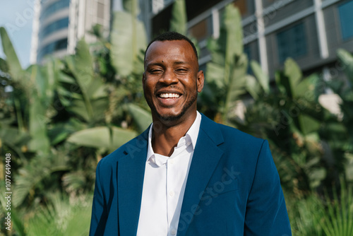 Happy businessman with greenery background photo