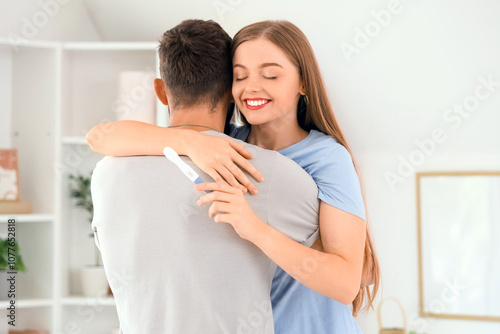 Happy young couple with pre...
