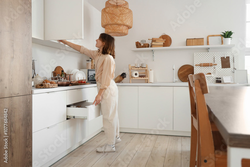 Young woman with open drawe...