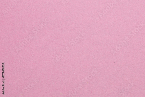 A pink background with a white object in the middle, textured origami paper backdrop