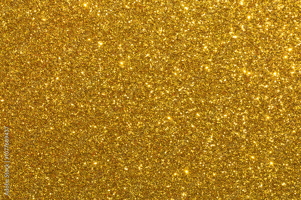 A gold glittery background with a lot of sparkles A gold glittery background with a lot of sparkles