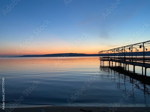 Çanakkale - pier at sunset over looking the Dardanelles Strait photo