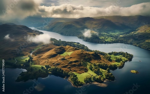 Aerial view of a serene lake surrounded by lush green hills and misty mountains. photo