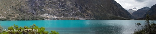 Beautiful turquoise lagoon in the Peruvian Andes called Laguna Chinancocha or Llanganuco photo