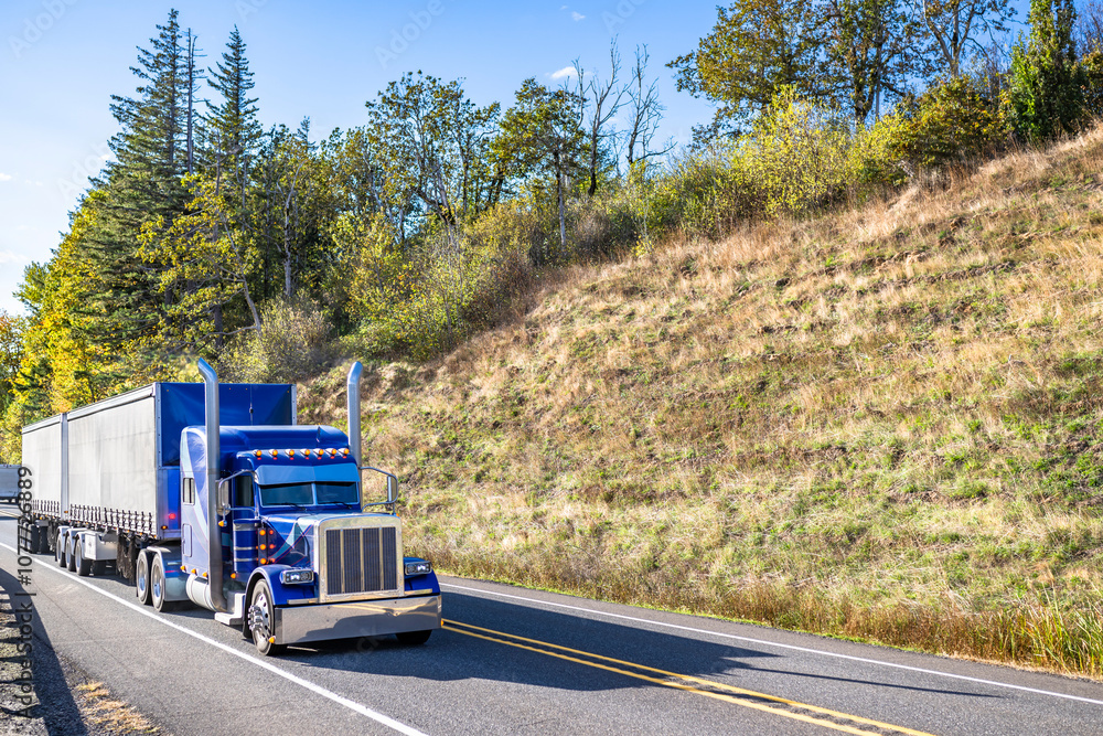 Classic American idol blue big rig semi truck tractor with light ...