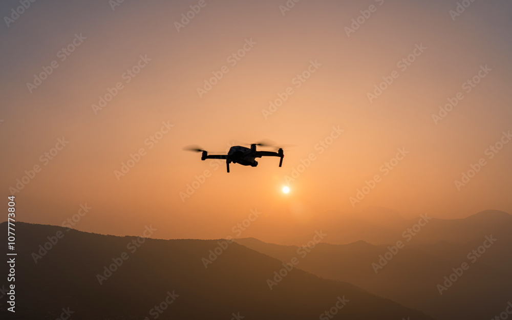 silhouette of flying drone over the Mountain in Bandipur, Nepal. silhouette of flying drone over the Mountain in Bandipur, Nepal.