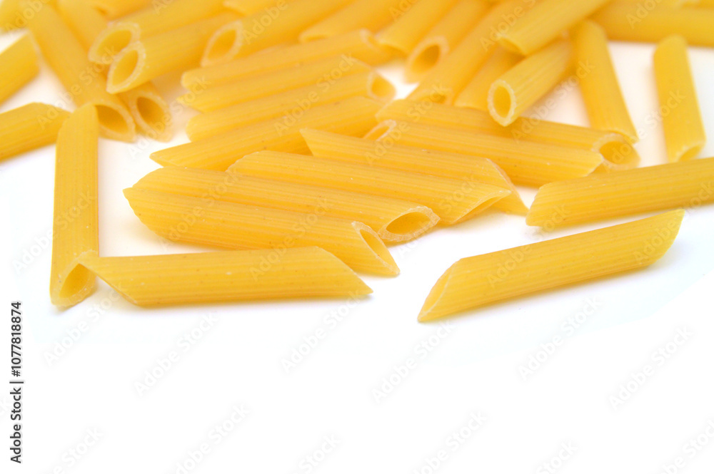 A portion of Rotini corkscrew pasta isolated on white. A portion of Rotini corkscrew pasta isolated on white.