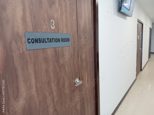 Interior of a clinic with a closed door and the sign of consultation room. photo taken in malaysia
