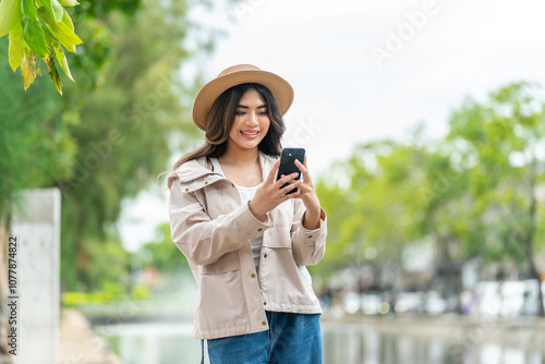Asian Woman Tourist Using Phone in Chiang Mai City, Thailand