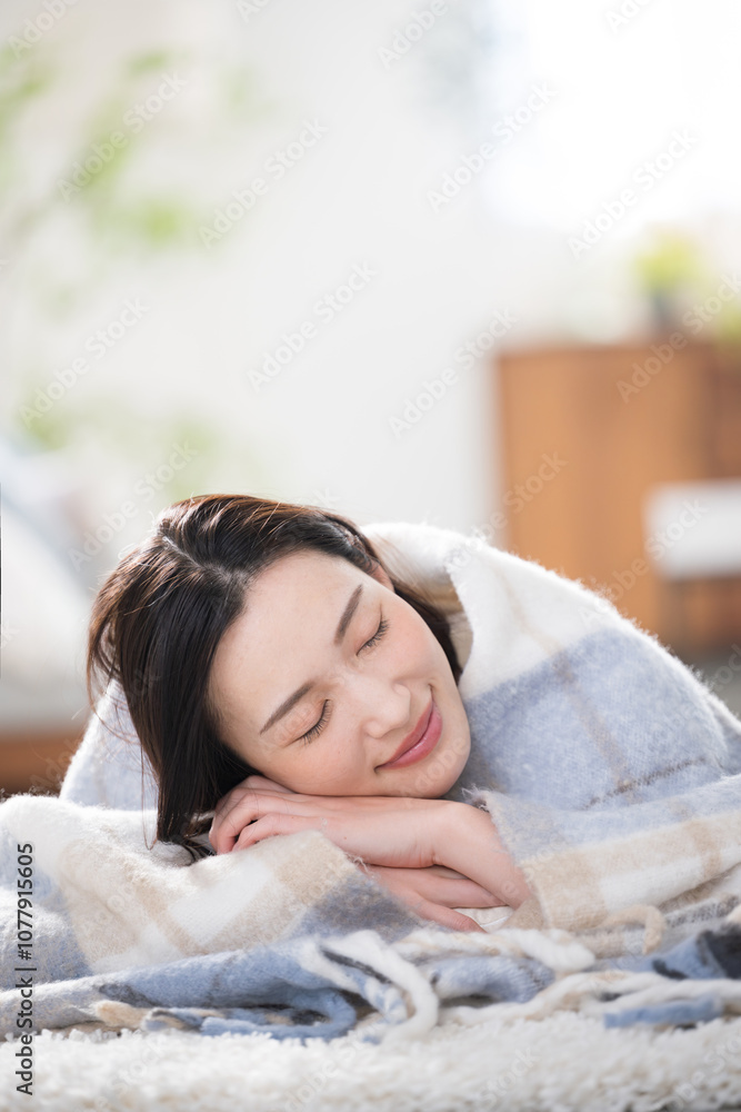 Closeup of a beautiful sleeping woman relaxing in a warm room, eyes closed,Image of a room in autumn/winter