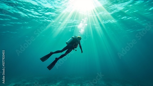 Wallpaper Mural An aquanaut silhouetted against the mesmerizing light and shadows as they venture into the depths of an underwater chasm conveying a sense of the raw beauty of the marine environment Torontodigital.ca