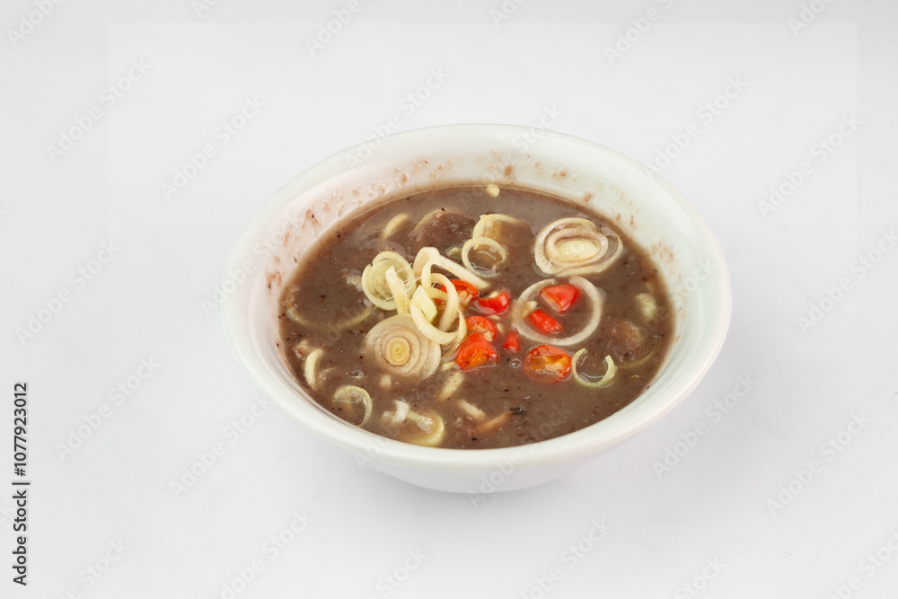 Shrimp paste with sliced lemongrass and chilli Sauce. Shrimp paste chili paste in white bowl. Mam tom Shrimp paste with sliced lemongrass and chilli Sauce. Shrimp paste chili paste in white bowl. Mam tom
