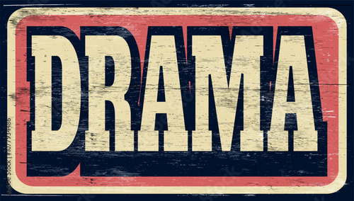 Aged and worn drama sign on wood