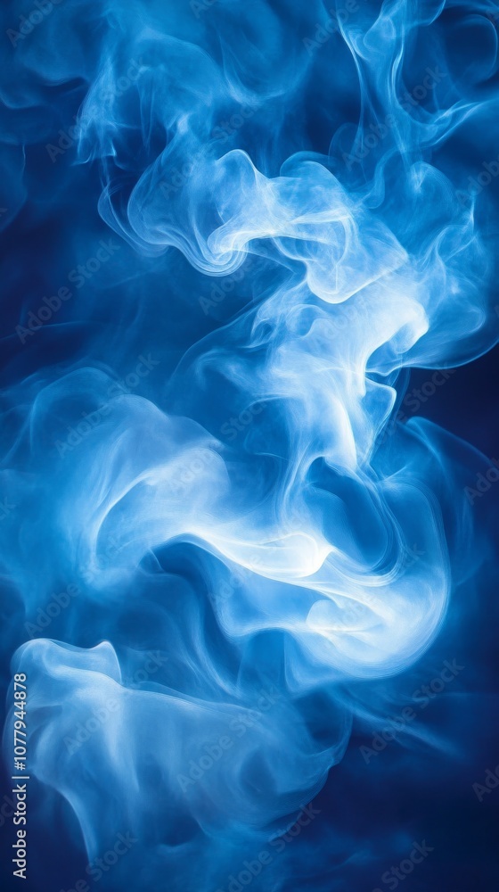 Abstract blue wisps of smoke swirling against Abstract blue wisps of smoke swirling against