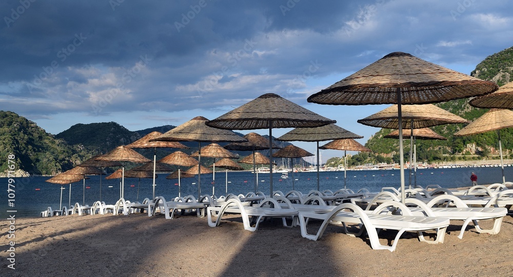 Sunbeds and umbrellas on the beach of Icmeler. Marmaris Sunbeds and umbrellas on the beach of Icmeler. Marmaris